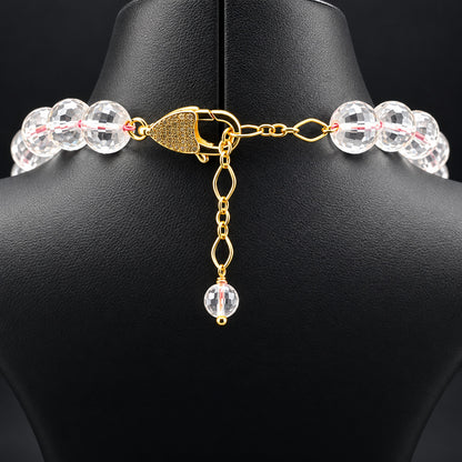 Chiusura in ottone dorato con zirconi e catenella di prolunga della collana in cristallo di rocca